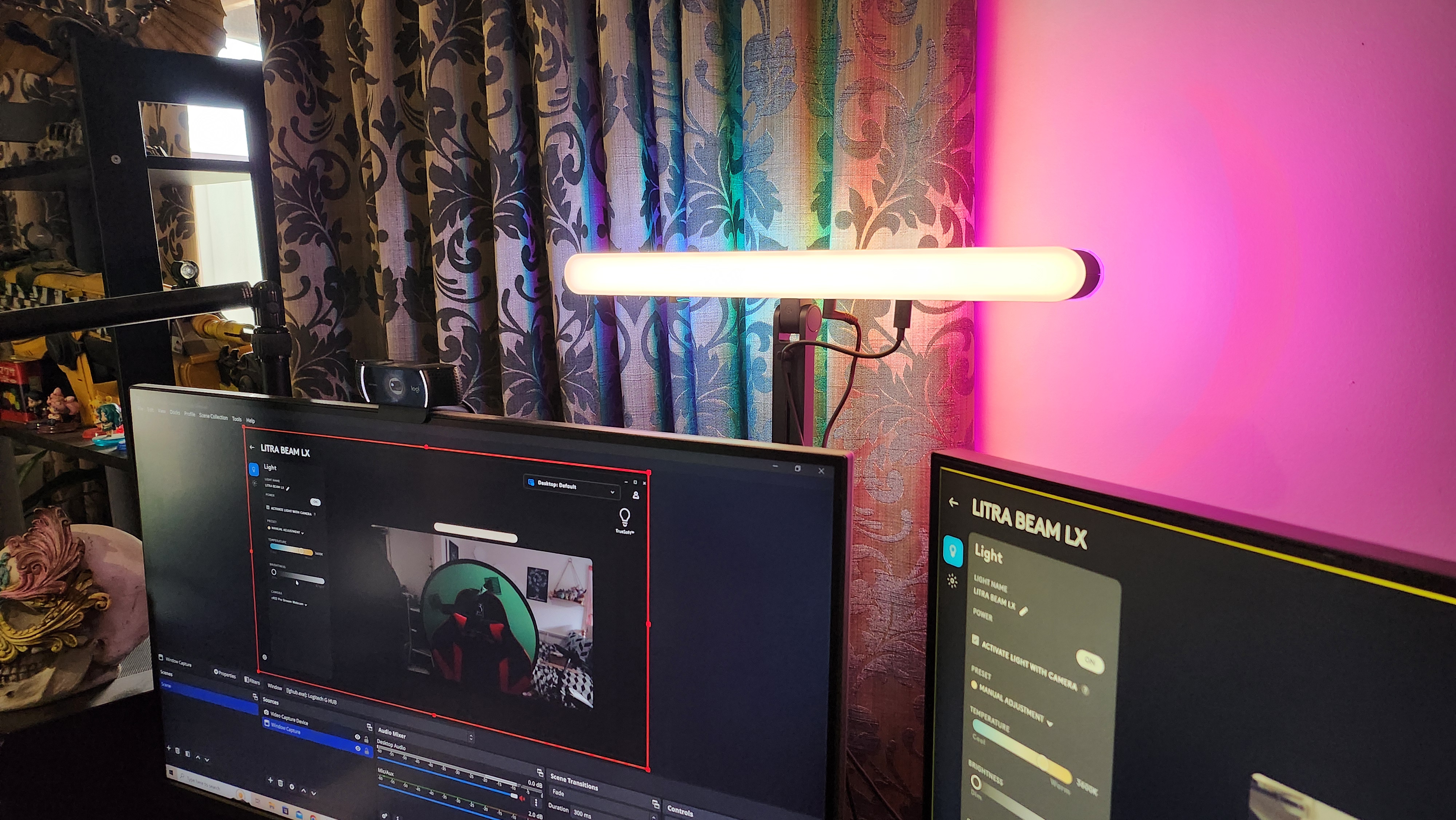 The Logitech Litra Beam LX key light set-up on a desk.