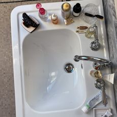 Photo of skincare products on a bathroom sink