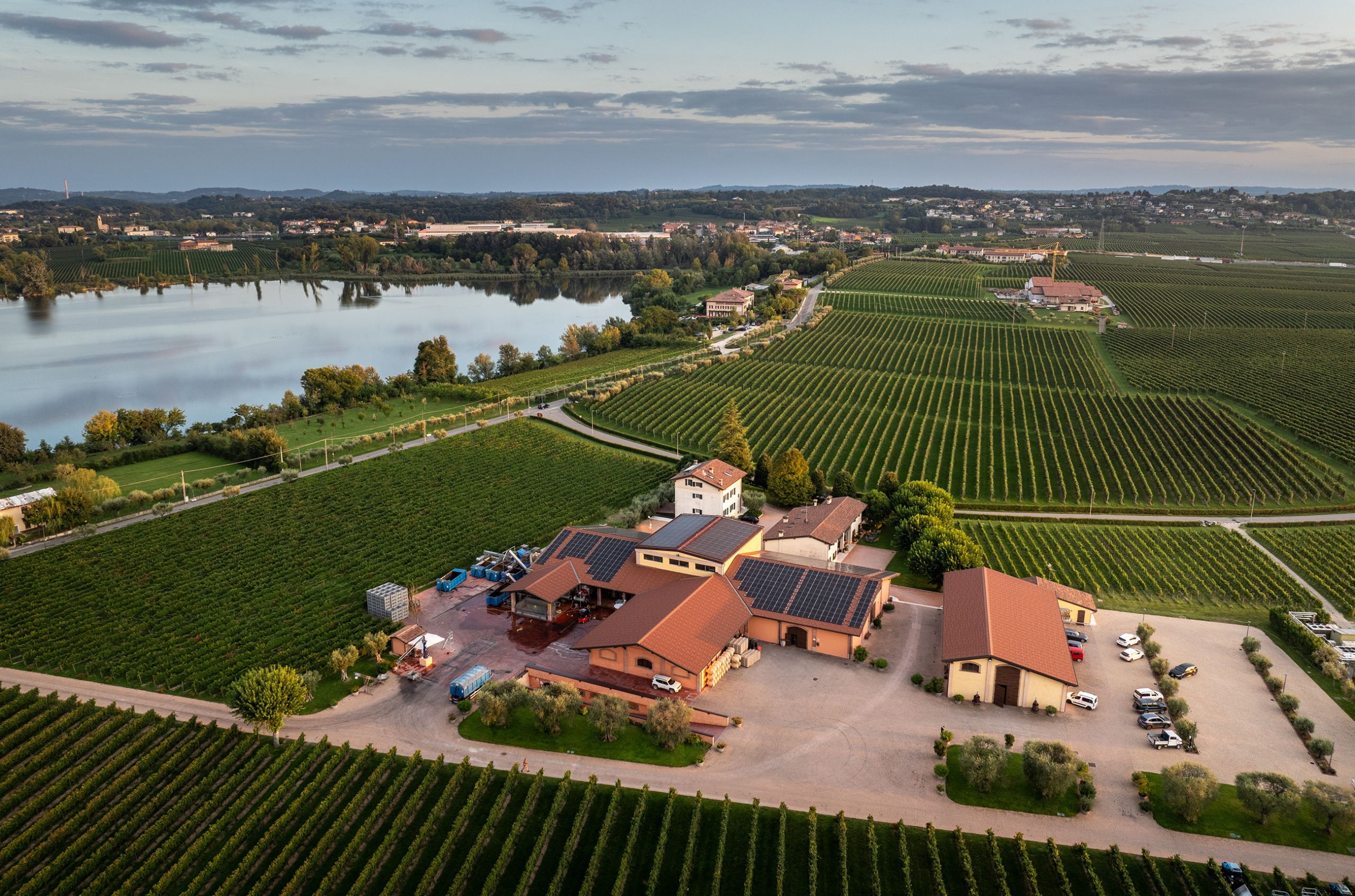 Ariel shot of the Zenato winery, surrounded by vines and with a lake in the background