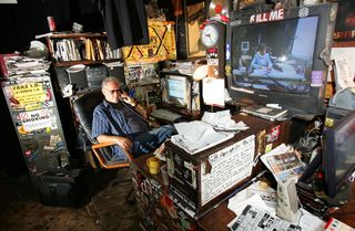 The late Hilly Kristal inside his CBGB's office, 2005