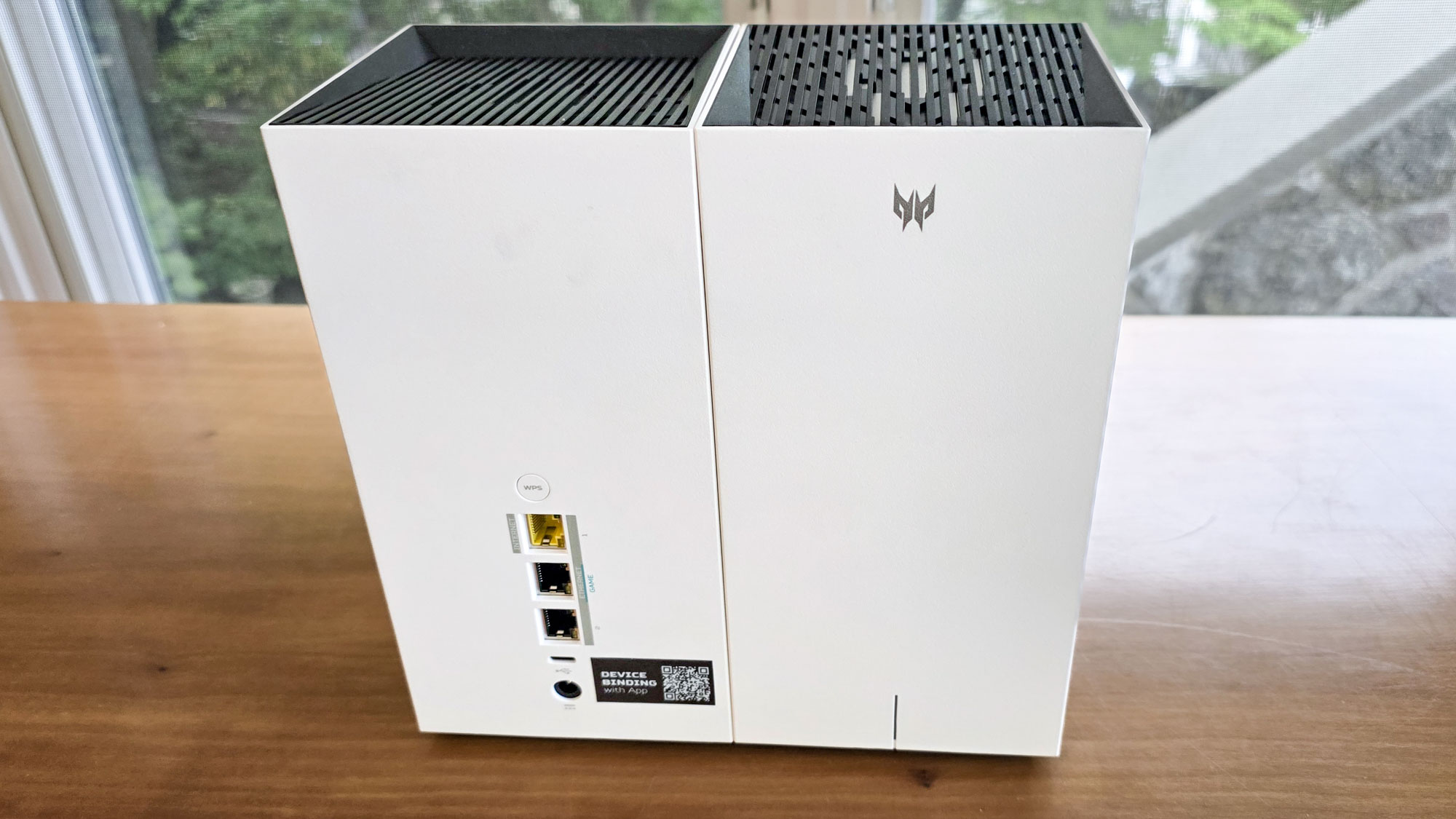 The front and back of an Acer Predator Connect T7 Wi-Fi 7 gaming mesh router.