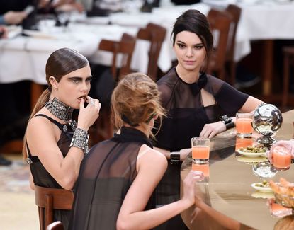 Cara Delevingne And Kendall Jenner Walk In Chanel's AW15 Cafe Fashion Show
