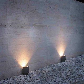 Lighting direct outdoor lighting on a gravel driveway