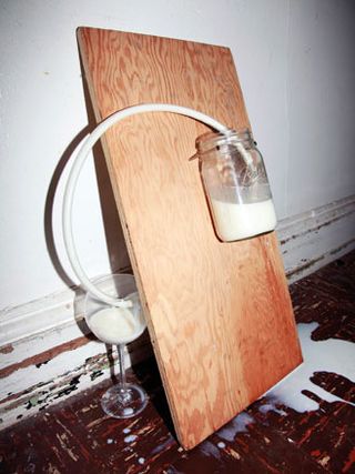 'Siphoning Milk into Wine Glass'