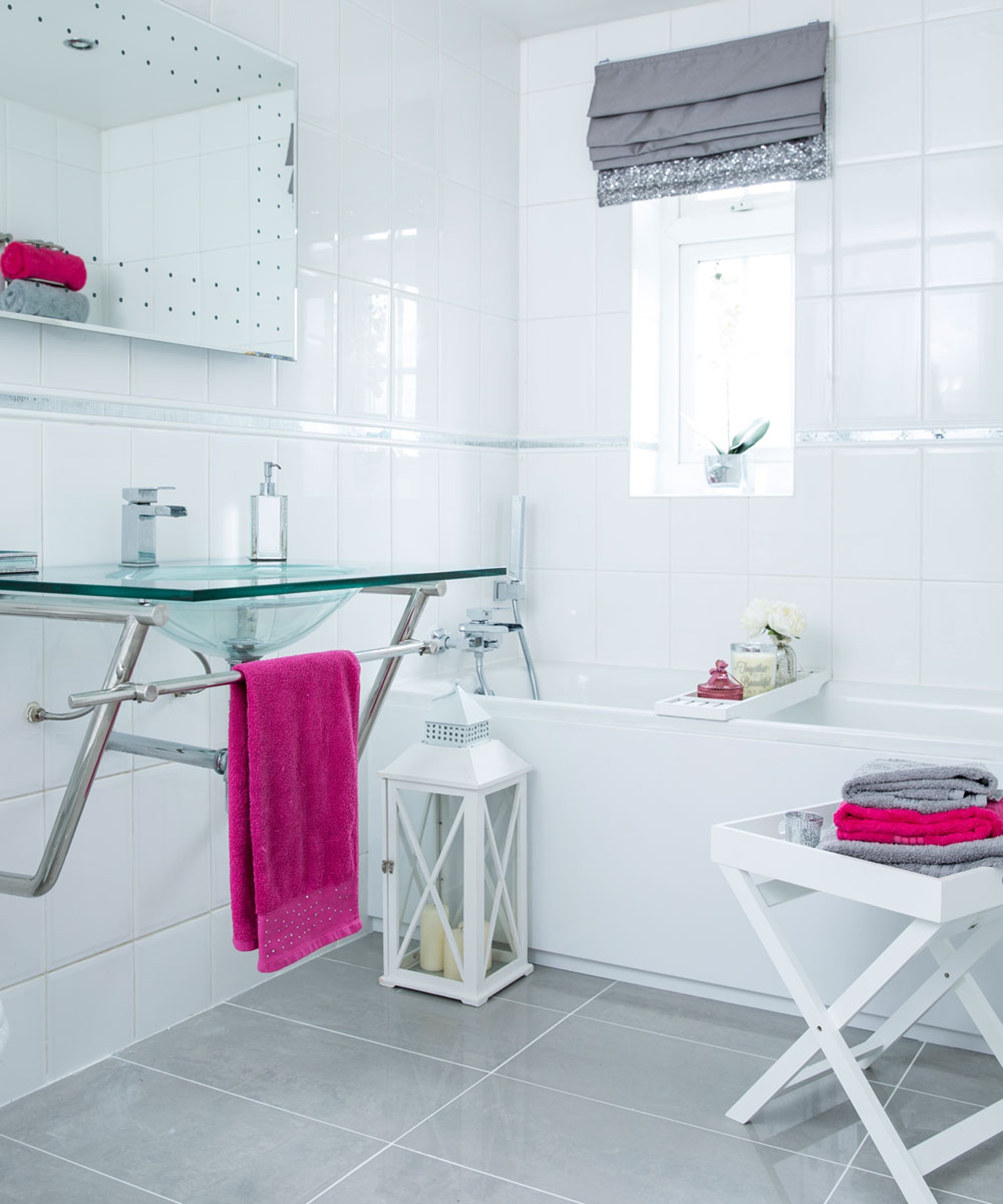 white bathroom with washbasin and wall mirror
