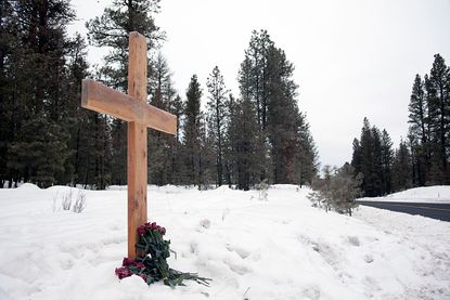 A cross erected at the site where Robert "LaVoy" Finicum was shot.