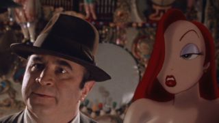 Bob Hoskins looks confused while standing next to Jessica Rabbit in Who Framed Roger Rabbit.