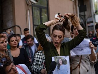 Women protesting the regime in Iran