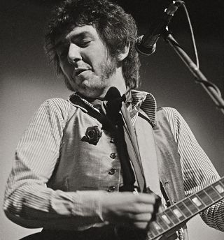 Performing with Slim Chance in 1975