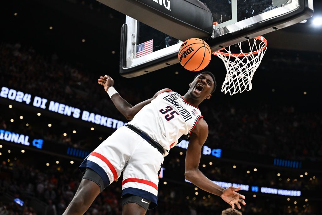 Samson Johnson of the Connecticut Huskies celebrates after a dunk against Illinois Fighting Illini during the first half in the Elite Eight round of the 2024 NCAA Men&#039;s Basketball Tournament.