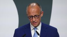 Friedrich Merz looking frustrated during a speech