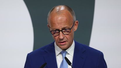 Friedrich Merz looking frustrated during a speech