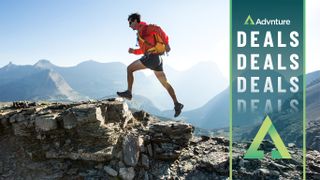 Man running on mountain ridge