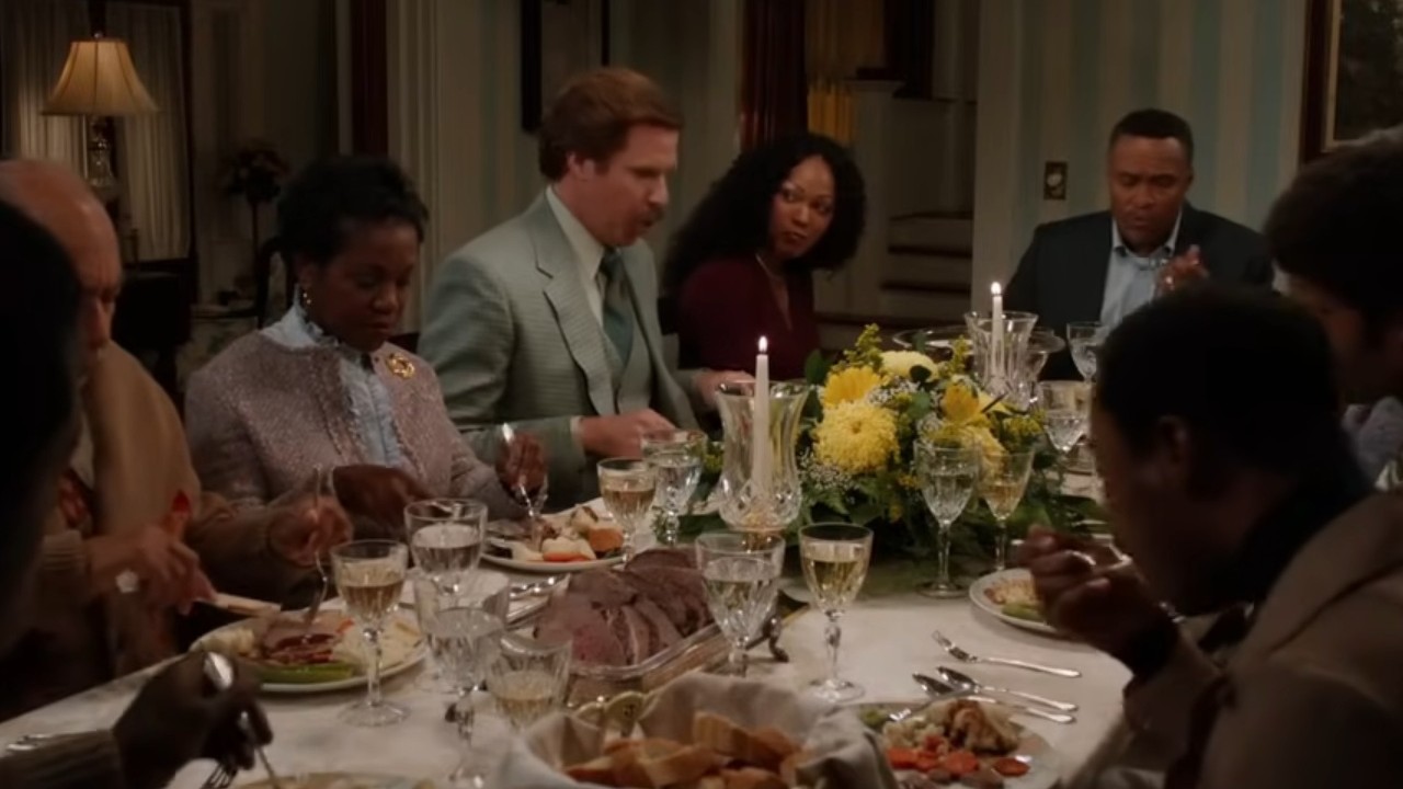 Will Ferrell sitting for dinner in Anchorman 2: The Legend Continues