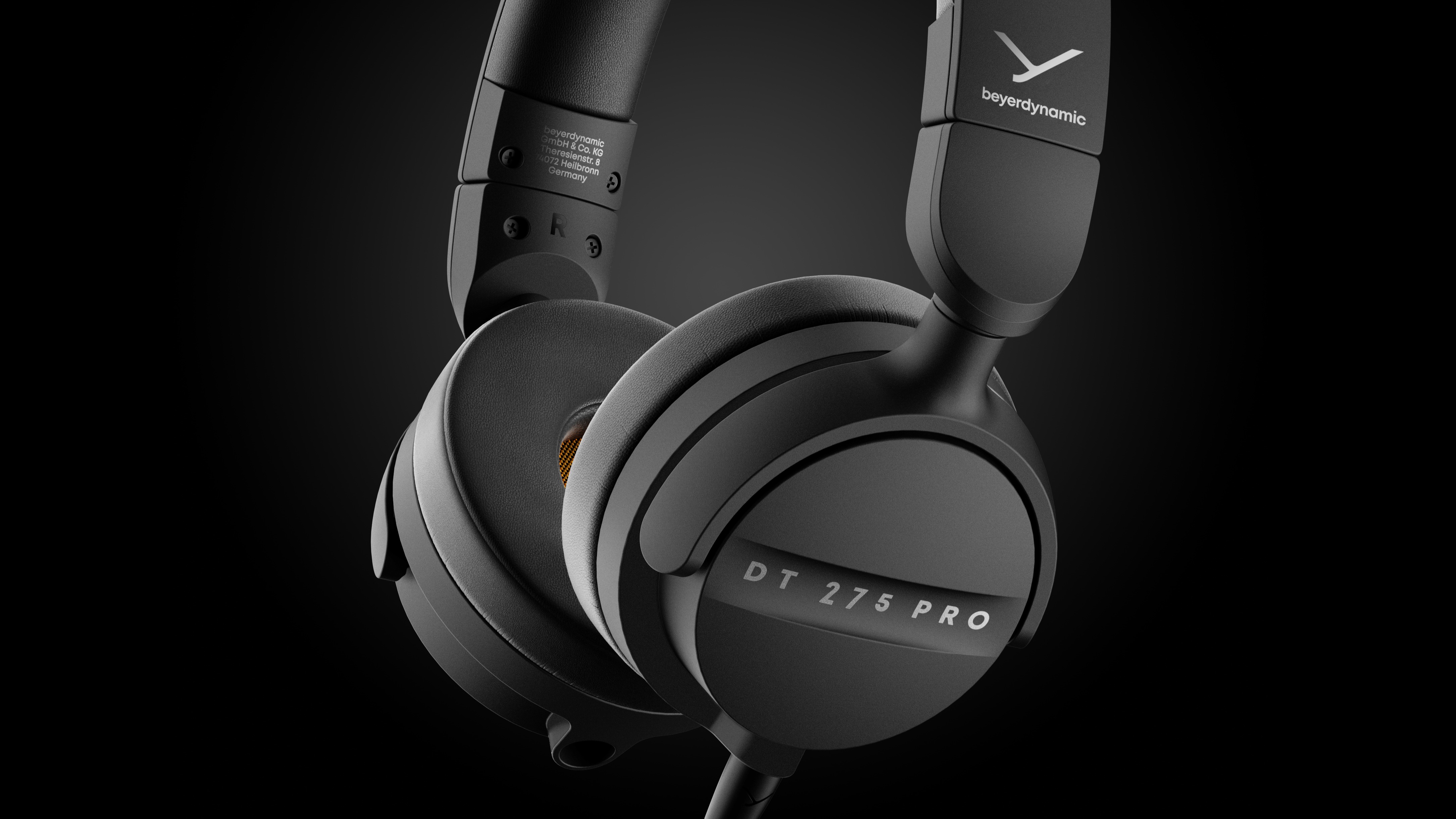 Beyerdynamic black wired on-ear headphones on a black background