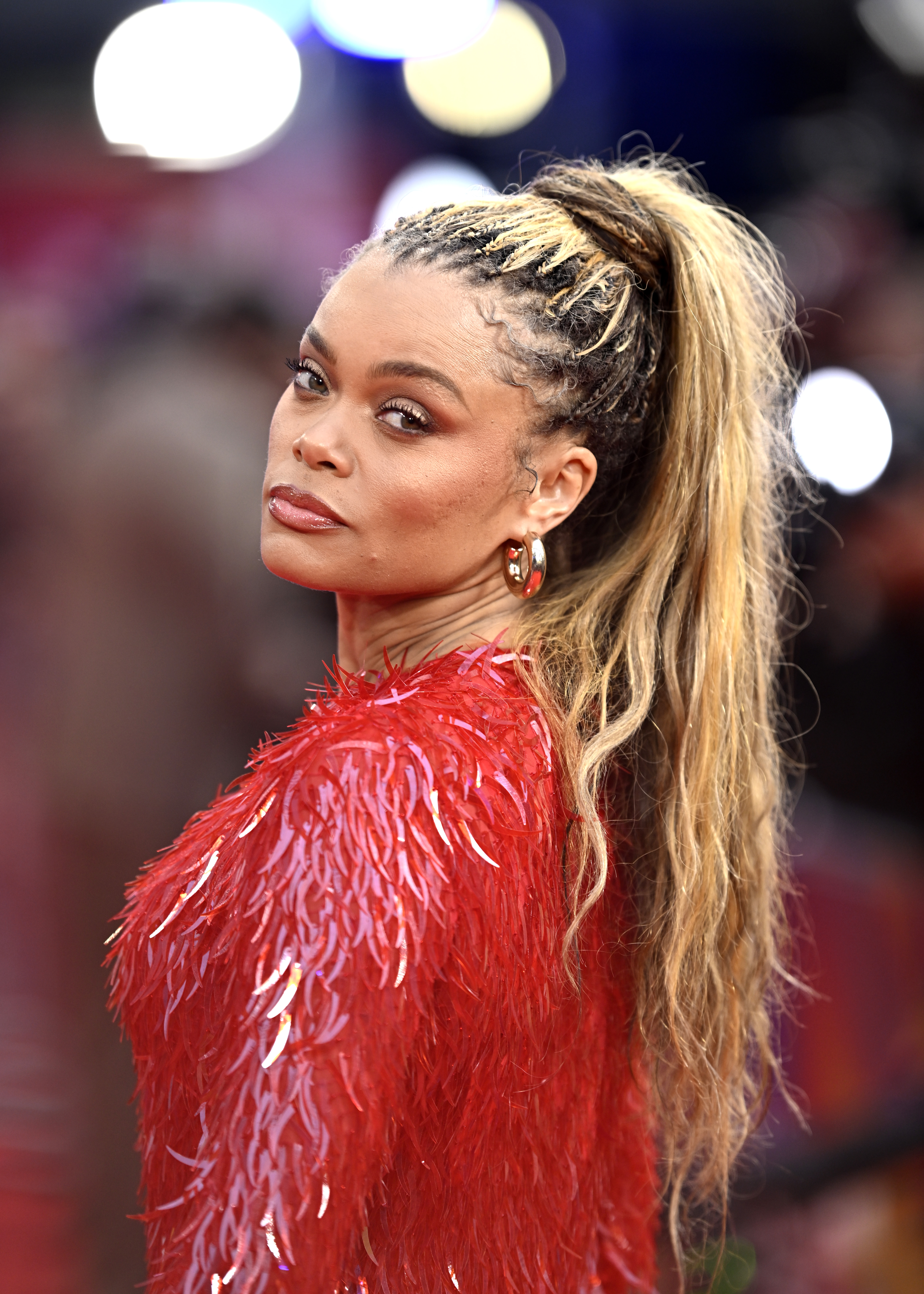 andra day with a braided high ponytail