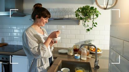 Woman eating from a bowl in kitchen, smiling, learning how to lose weight in a week