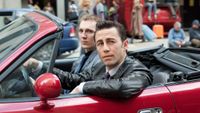 Paul Dano and Joseph Gordon-Levitt in a red car in Looper