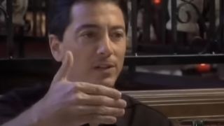 Scott Baio talking to a woman in Scott Baio is 45...And Single