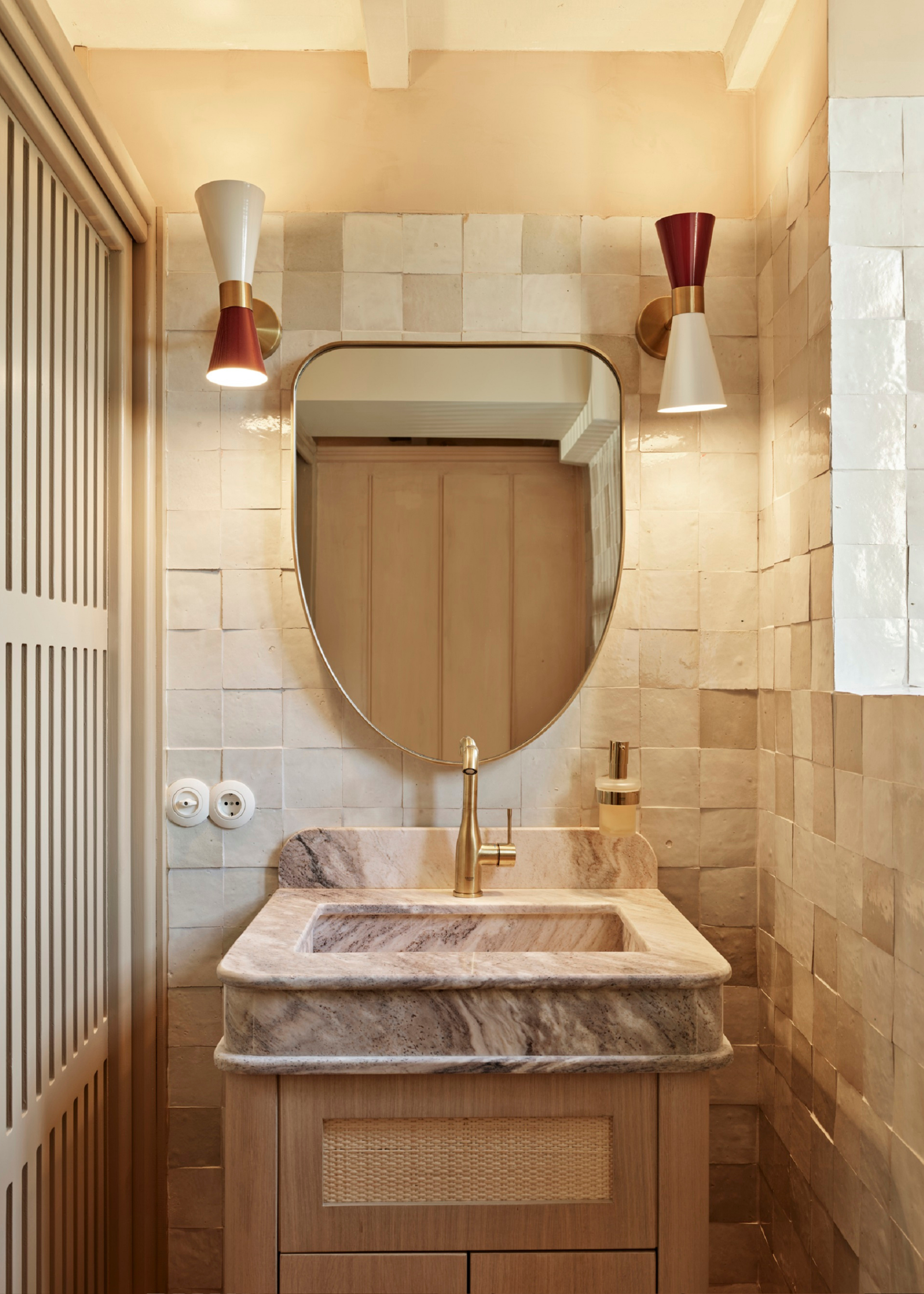 sink area with zellige tiled backsplash marble sink and a small mirror