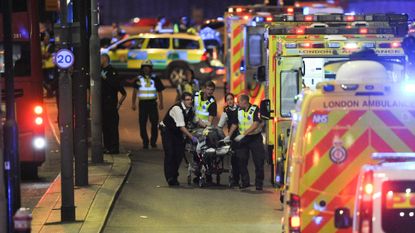 Police and paramedics attend the scene following an attack on London Bridge in June 2017