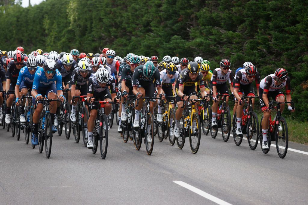 VALENCE FRANCE JULY 06 Ivn Garca Cortina of Spain and Movistar Team Sean Bennett of The United States and Team Qhubeka NextHash Simon Clarke of Australia and Team Qhubeka NextHash Nils Politt of Germany and Team BORA Hansgrohe Jonas Vingegaard of Denmark and Team JumboVisma white best young jersey Tadej Pogaar of Slovenia and UAETeam Emirates yellow leader jersey during the 108th Tour de France 2021 Stage 10 a 1907km stage from Albertville to Valence LeTour TDF2021 on July 06 2021 in Valence France Photo by Chris GraythenGetty Images