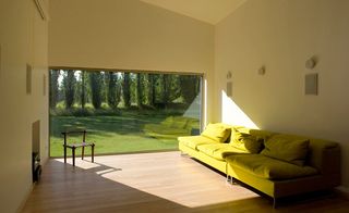 Plenty of glass allows for the house to interact with its verdant surrounds