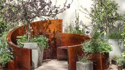 RHS Chelsea Flower Show 2026 seating area with potted plants