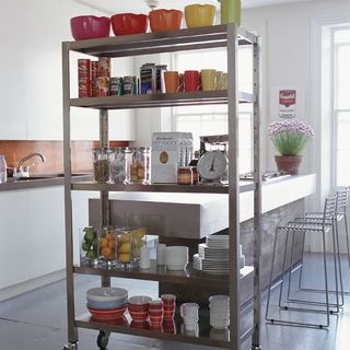 Kitchen with white walls and metal rack