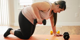 Image of woman doing weights at home workout 
