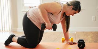 Image of woman doing weights at home workout