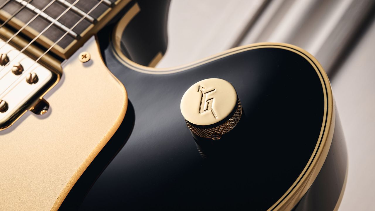 Gretsch Professional Collection Broadkaster LX Center Block: the handsome semi-hollow is finished in black with gold hardware and here is photographed in close-up.