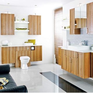 bathroom with wooden cabinet and table top washbasin