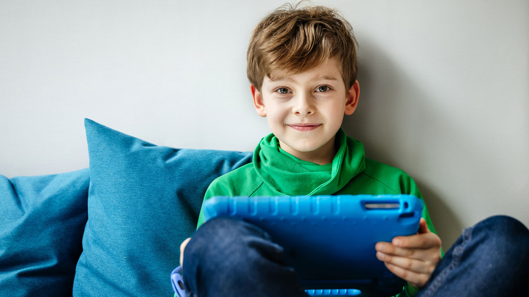 boy holding tablet