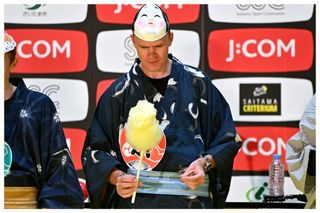 Christopher Froome of United Kingdom and Team Israel - Premier Tech makes cotton candy and participates in a Quiz Contest at Thematic Japanese Festival during the 8th Tour de France Saitama Criterium 2022