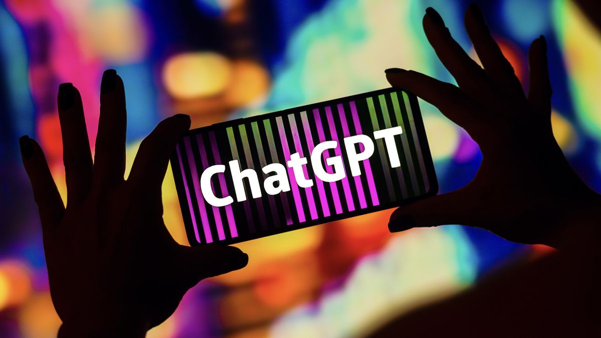 Somebody holding a smartphone with ChatGPT written on its face