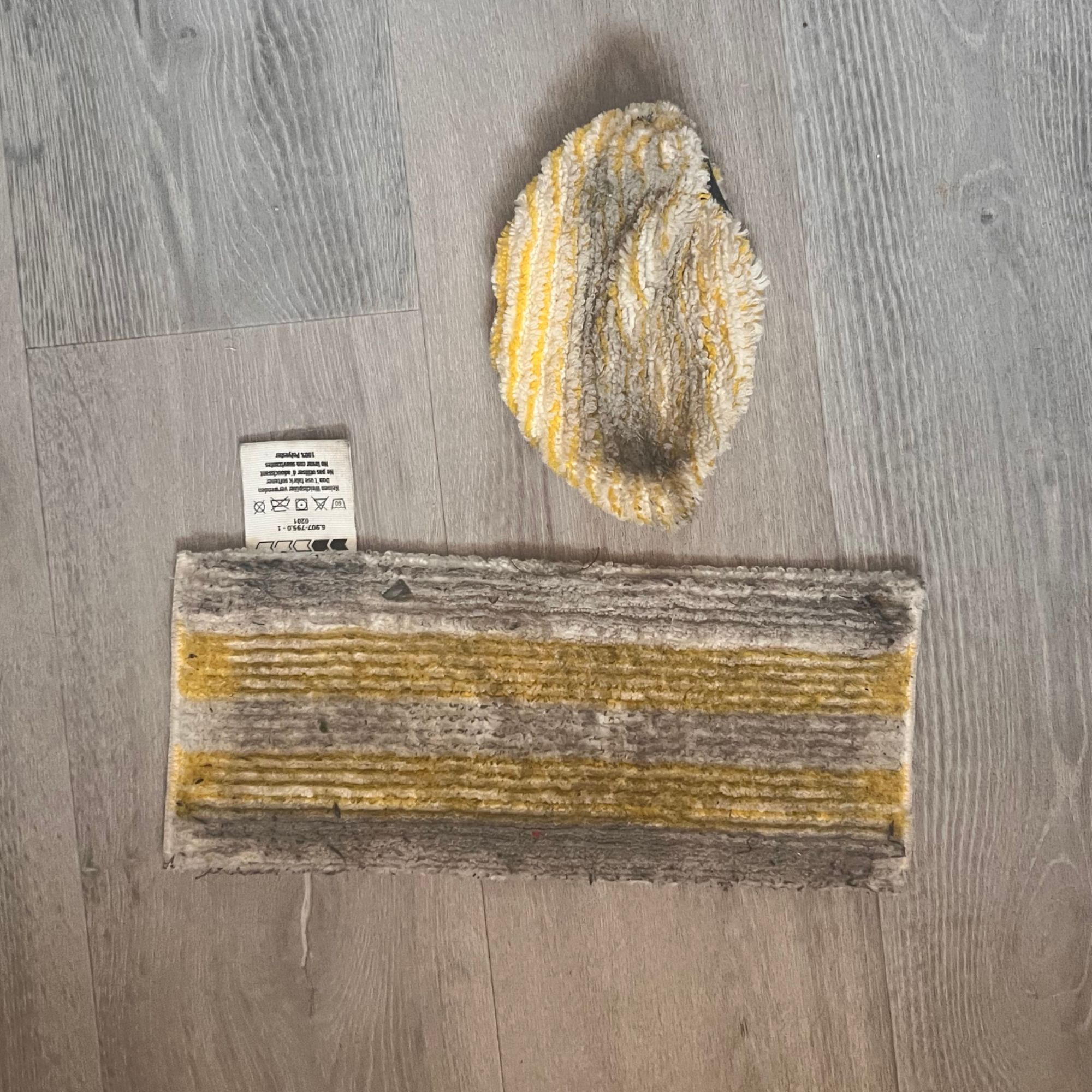 Karcher SC 1 Multi & Up Extra dirty mop heads laying on the floor