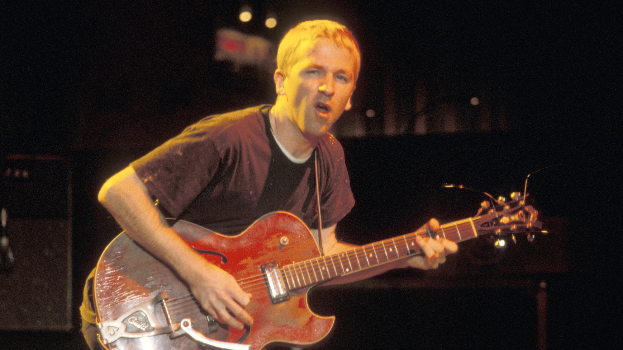 Guitarist Greg Brown is shown performing on stage during a live concert appearance with Cake on November 12, 1996