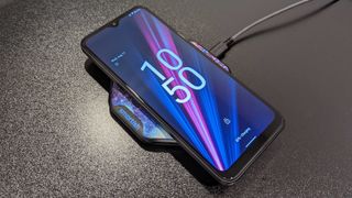 T-Mobile Revvl 6 Pro on a wireless charger