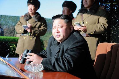 North Korean leader Kim Jong Un watches a military drill