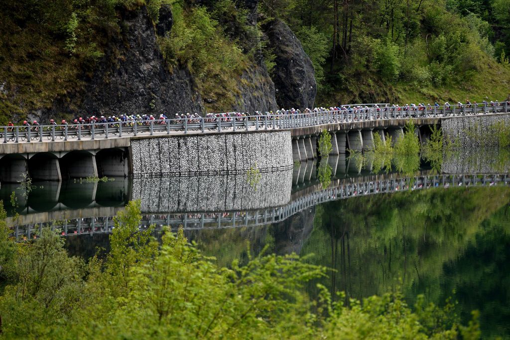 MONTE ZONCOLAN ITALY MAY 22 The Peloton passing through Menudos Bridge 303m during the 104th Giro dItalia 2021 Stage 14 a 205km stage from Cittadella to Monte Zoncolan 1730m Landscape Forest UCIworldtour girodiitalia Giro on May 22 2021 in Monte Zoncolan Italy Photo by Tim de WaeleGetty Images