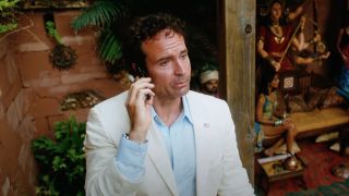 Max (Jason Patric) makes a phone call on The Losers