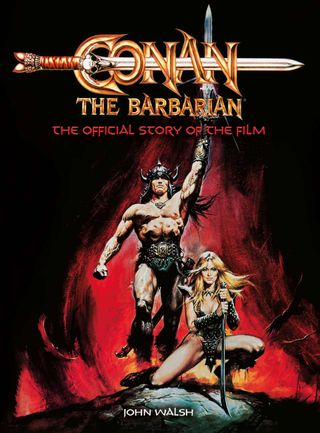 Conan The Barbarian holding a sword aloft as a woman kneels by his feet.