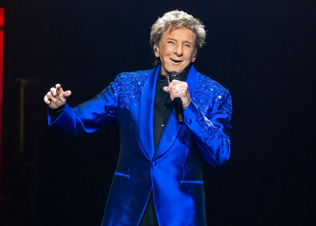 Barry Manilow singing into a microphone