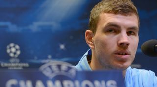 DORTMUND, GERMANY - DECEMBER 03: Edin Dzeko looks on during a Manchester City press conference ahead of their UEFA Champions League group stage match against Borussia Dortmund at Signal Iduna Park on December 3, 2012 in Dortmund, Germany. (Photo by Lars Baron/Bongarts/Getty Images)