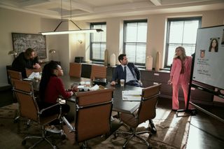 Angus Sampson as Denis "Cisco" Wojciechowski, Jazz Raycole as Izzy Letts, Manuel Garcia-Rulfo as Mickey Haller, Becki Newton as Lorna Crane, sitting around a conference table in a law office, in episode 302 of The Lincoln Lawyer.