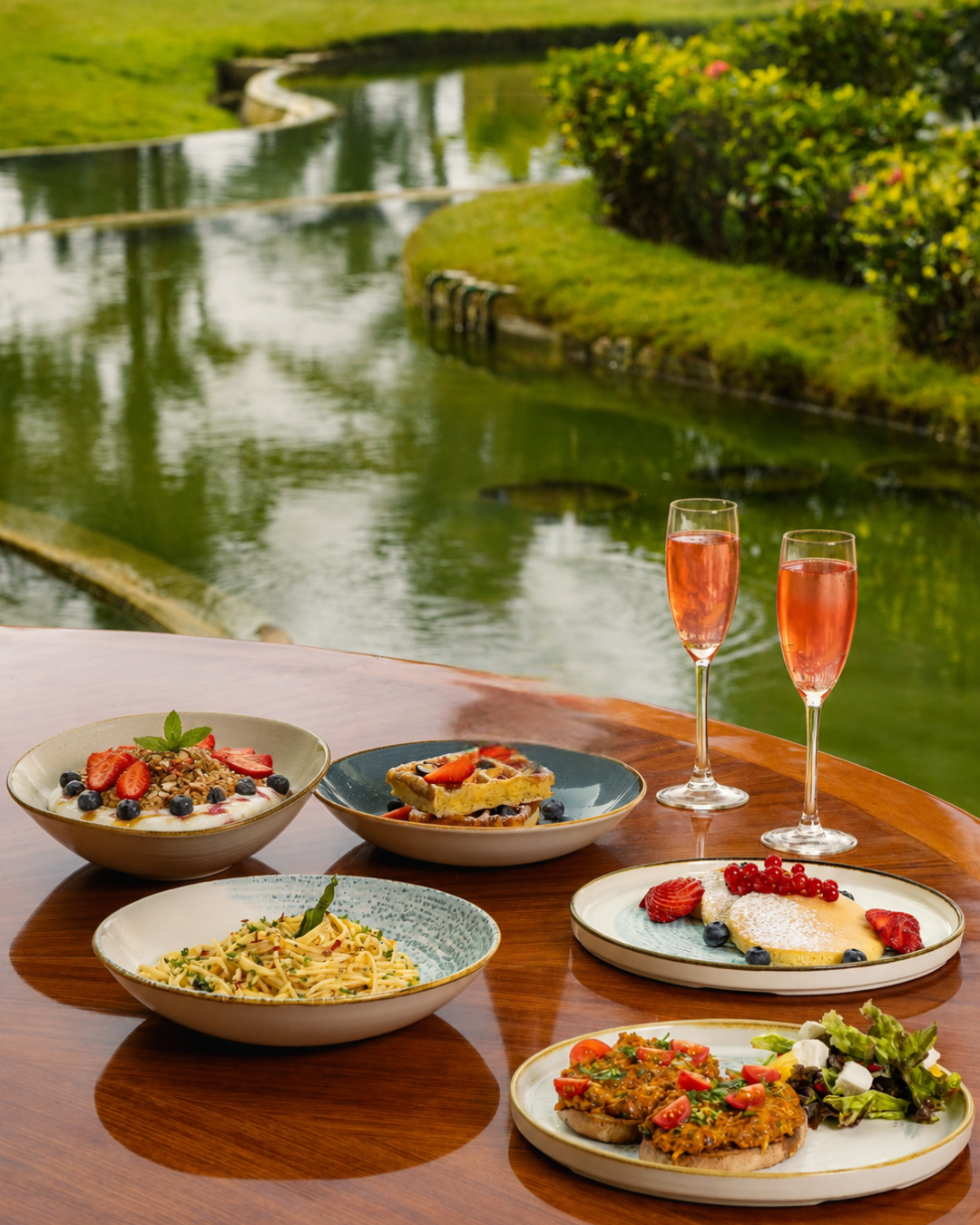 Two Champagne glasses and brunch dishes
