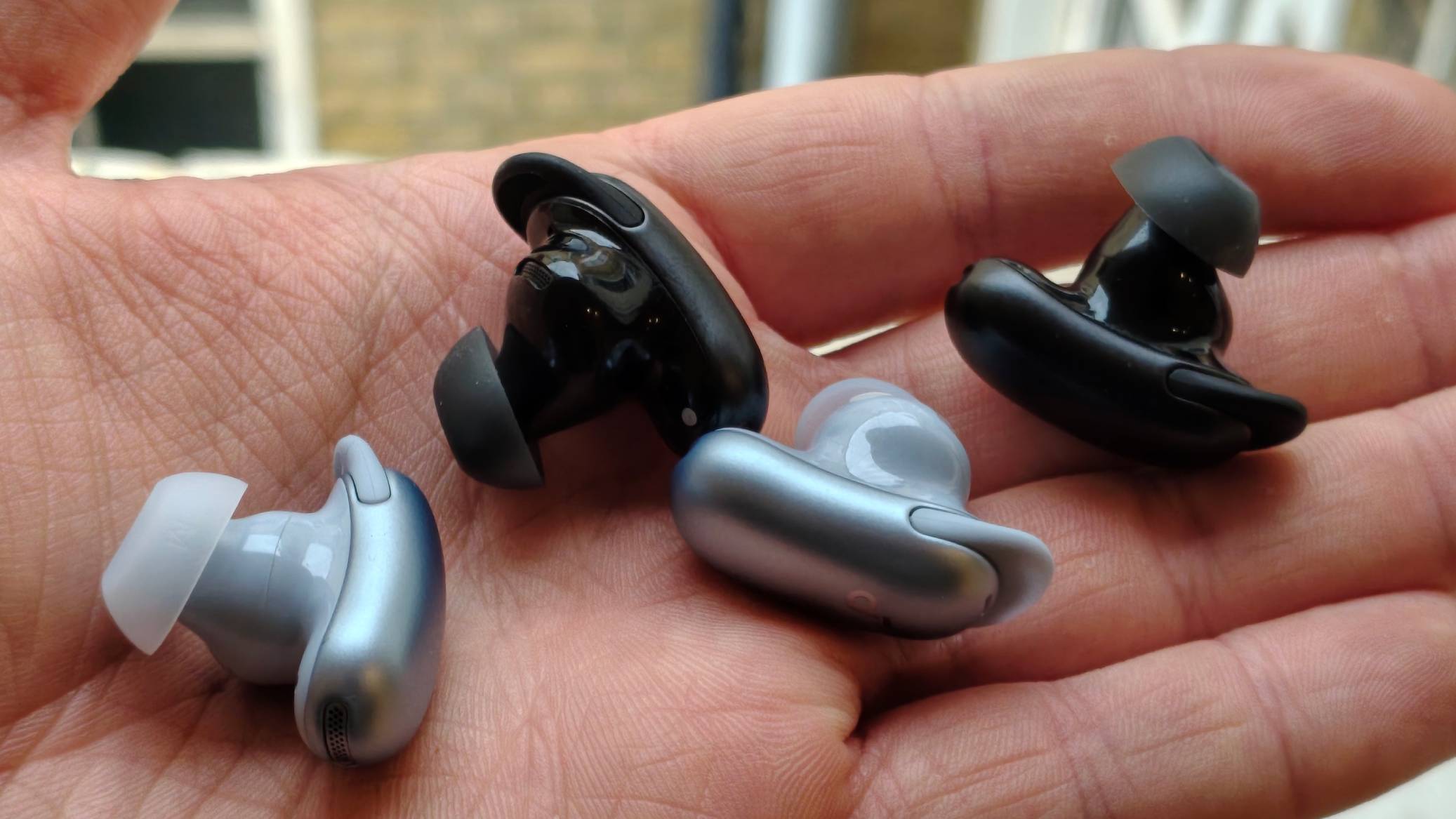 The Soundcore Liberty 5 Pro and 5 Pro Max's earbuds, in a man's hand.