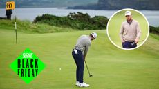 Sam Burns hits a putt and walks off the green