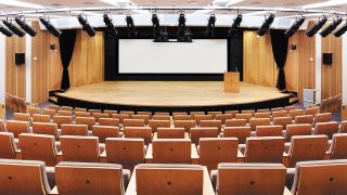 The auditorium is used for events such as stockholder meetings, company announcements, and large-screen review of games at various stages of development. Its XTP system provides flexible, high quality signal distribution equally well for business presentations or dynamic game content.